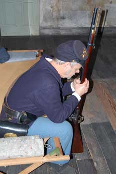 Man in Union uniform, sitting.